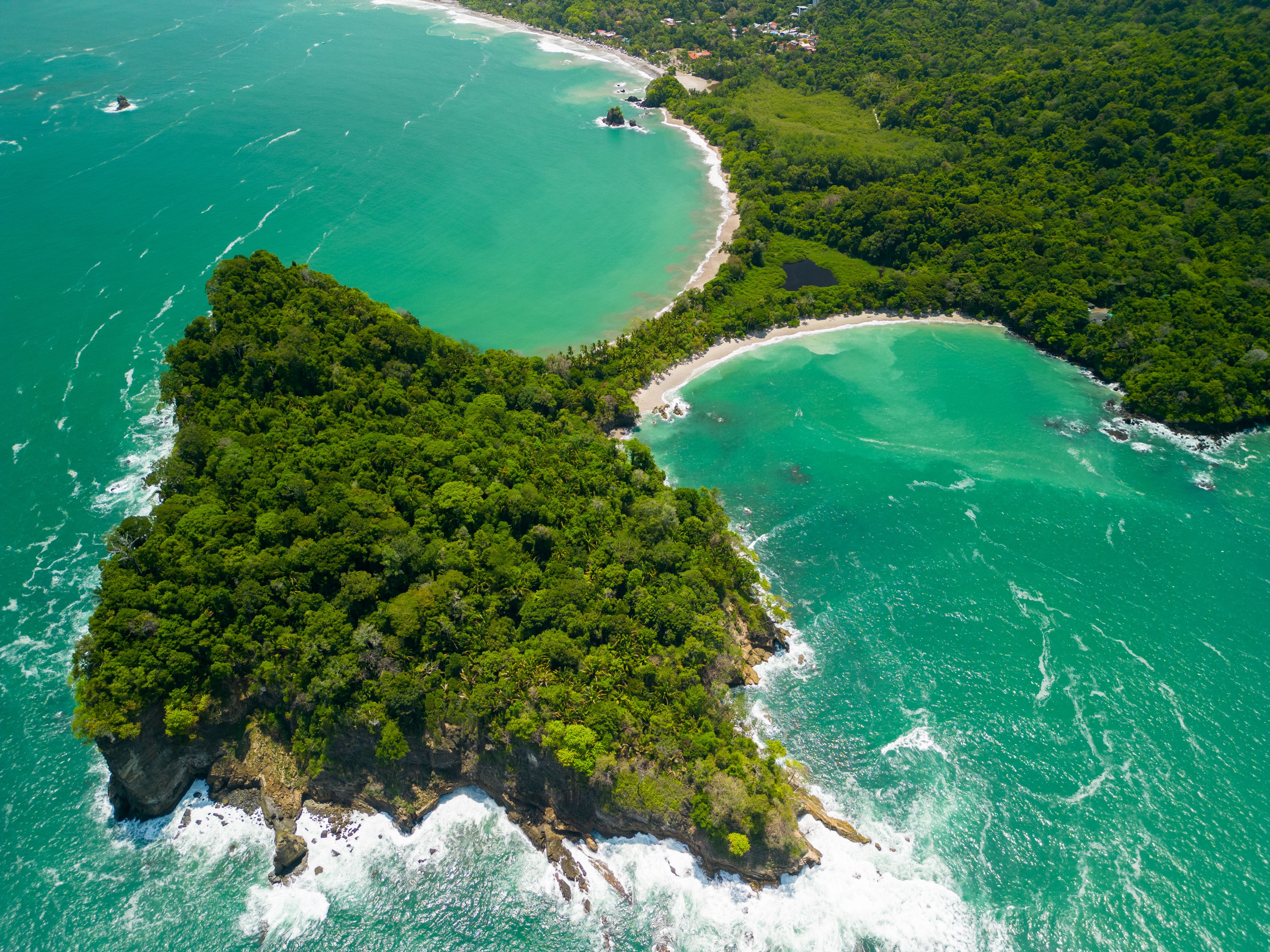 view-of-a-lush-green-peninsula-surrounded-by-turqu-2026-03-18-12-19-16-utc